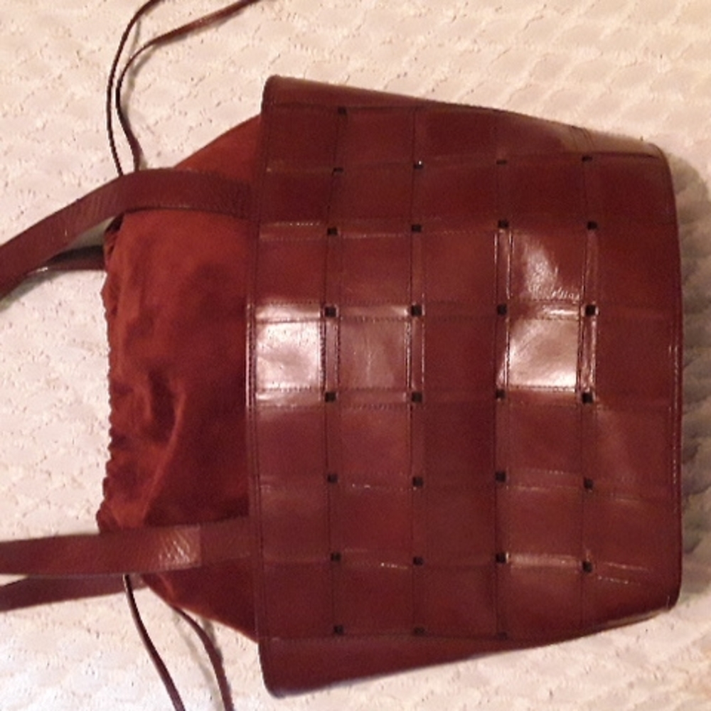 LJS collections drawstring shoulder bag. Completely leather exterior
